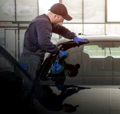 Prime Auto Glass technician performing a windshield replacement